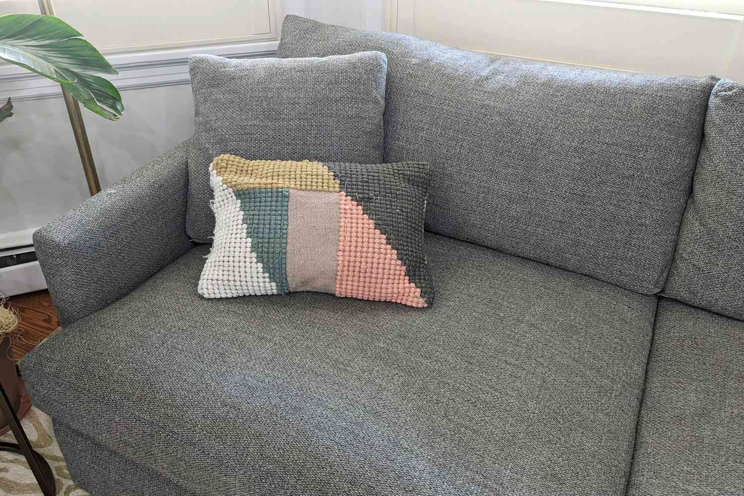 A pillow on the Crate & Barrel Lounge Couch