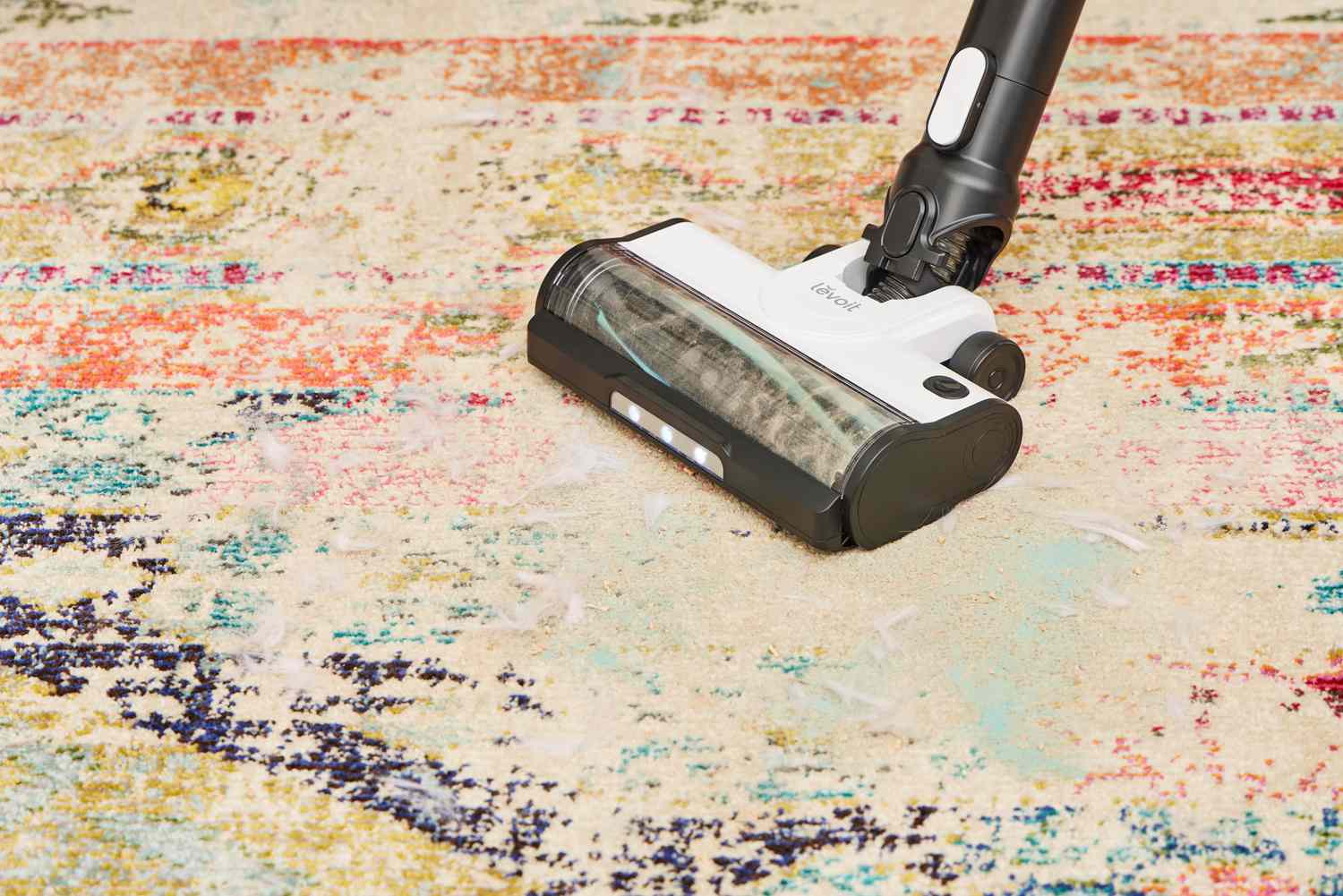 A close-up of the Levoit LVAC-200 Cordless Stick Vacuum on a rug